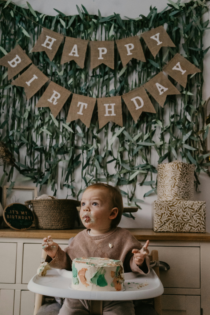 Baby with the cake.